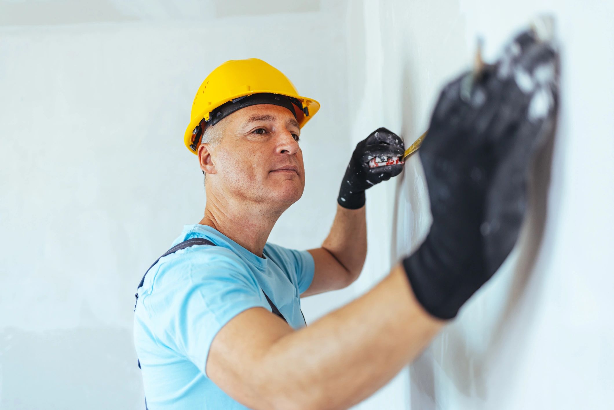 Contractor measuring for a home renovation installation