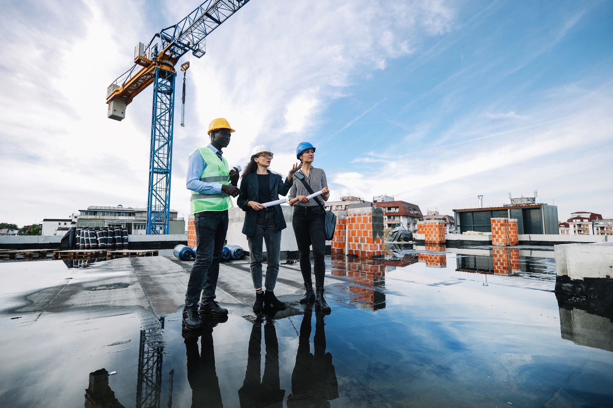 Construction team reviewing work on a residential build