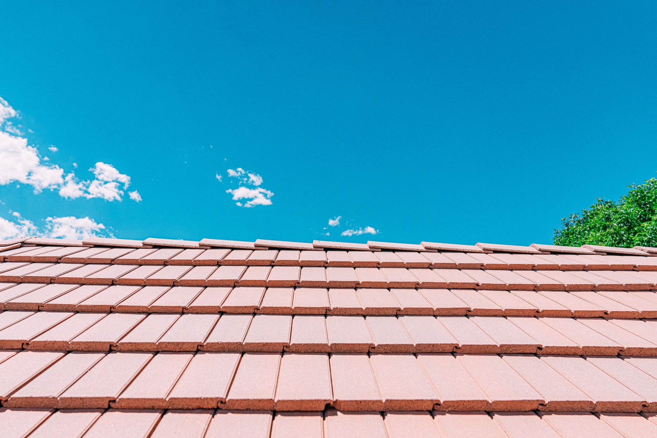 Close-up view of a finished roof surface and ridge line