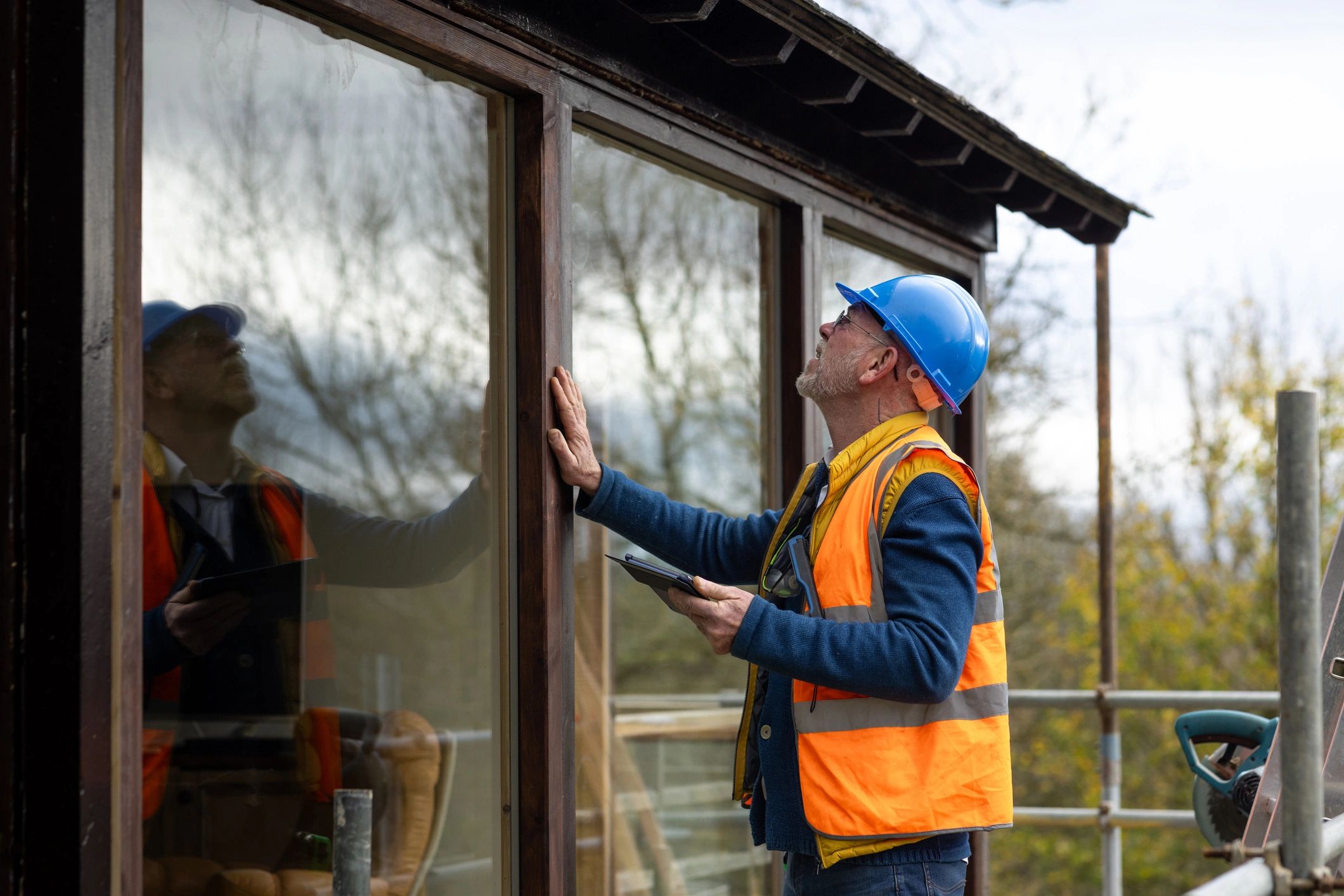 Home inspector reviewing exterior work