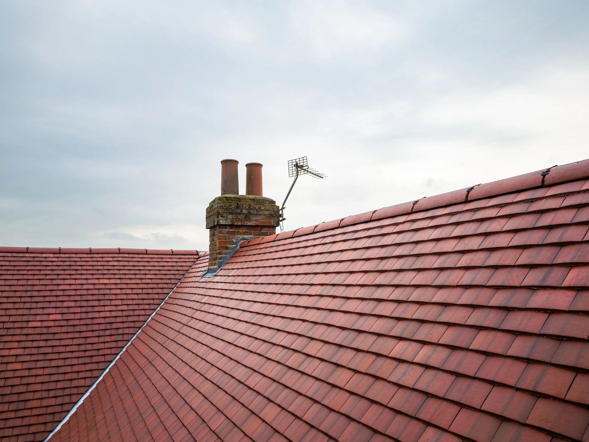 Aerial view of a home with a newly installed roof