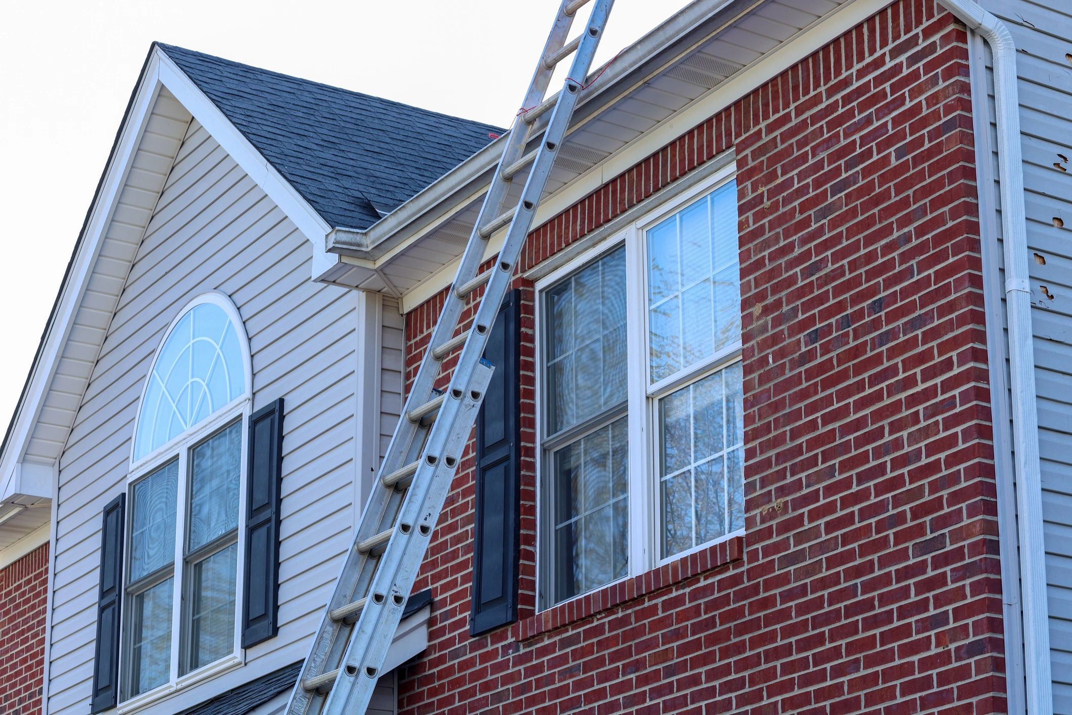 Ladder set up for roof repair work